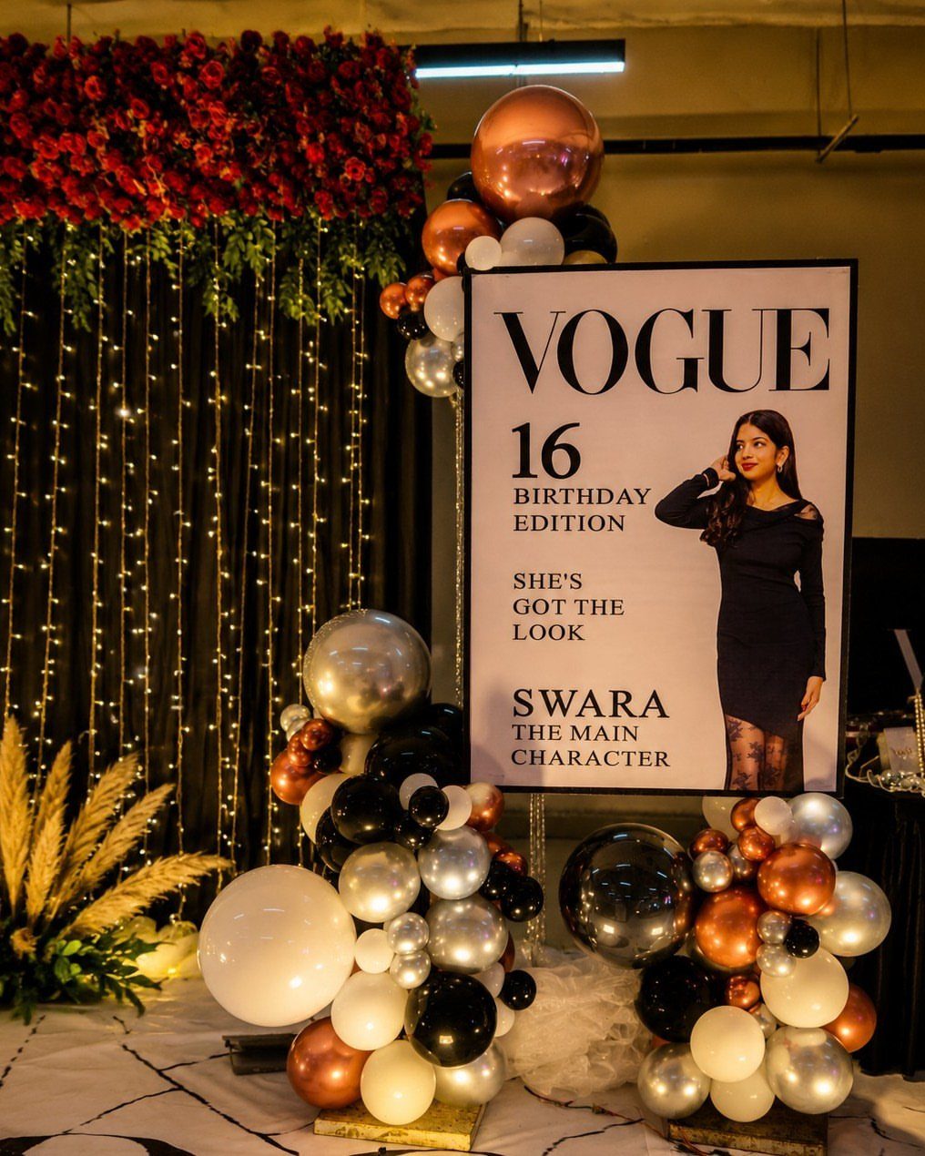 Vogue magazine cover cutout for a 16th birthday with balloons and fairy lights