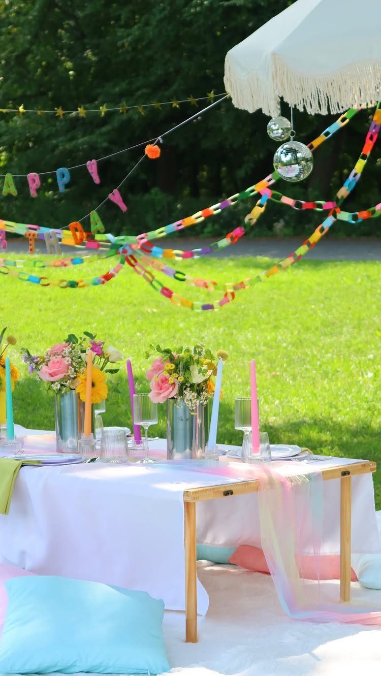 Low picnic table with flowers and colorful decorations set in a green park