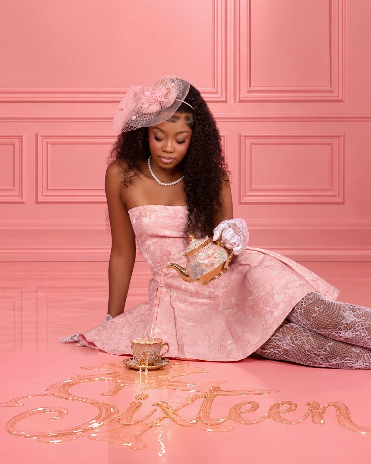 Young woman in a pink gown pouring tea in a pink room.
