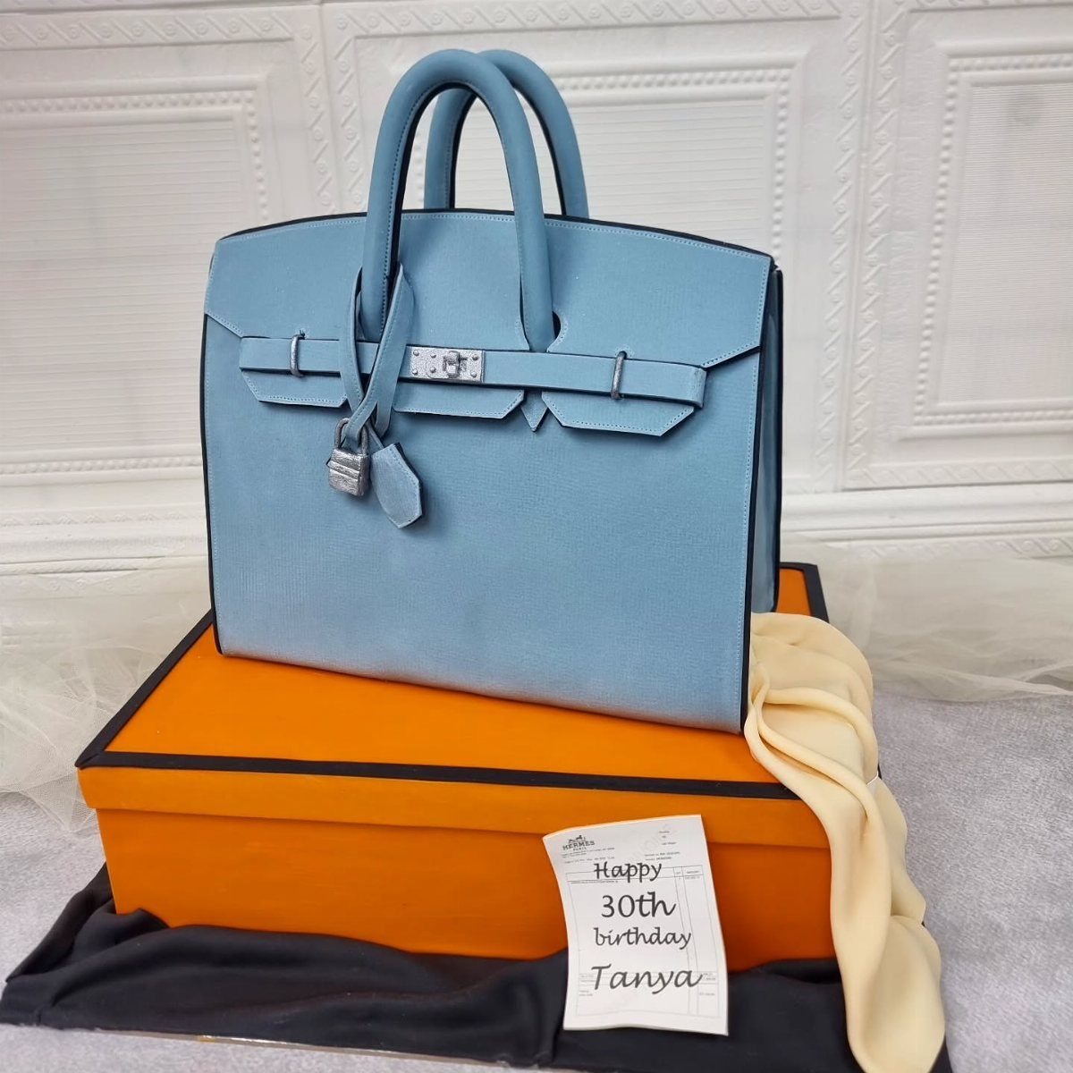 Designer handbag and shoebox cakes for a 30th birthday celebration.