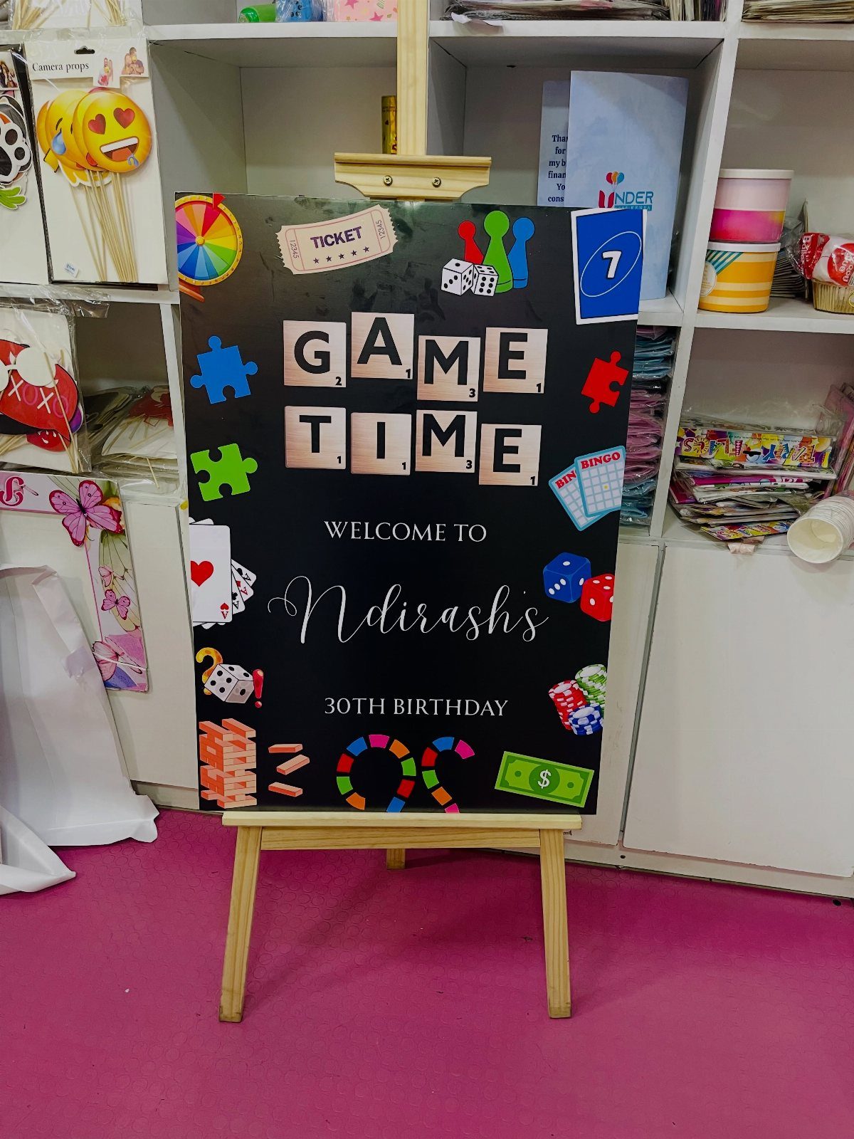 Welcome sign for a 30th birthday game night featuring colorful game icons.