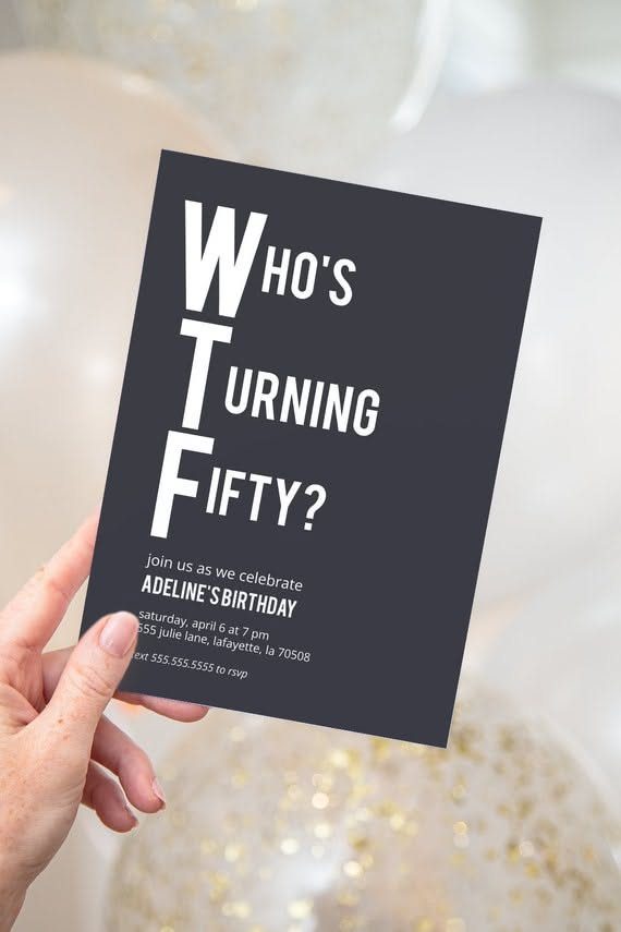 Black 50th birthday invitation with humorous white text held against gold balloons