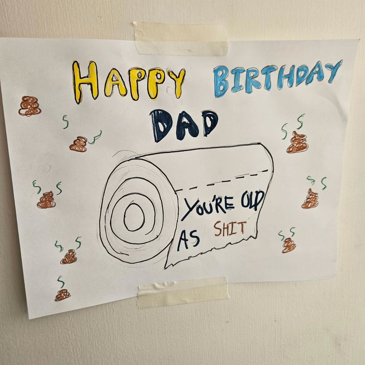 Hand-drawn birthday sign for dad with a toilet paper roll and funny text.