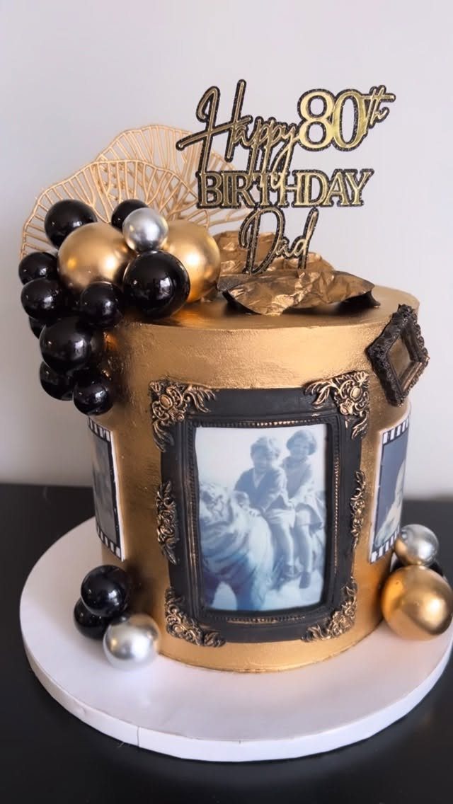 Gold 80th birthday cake for dad with vintage framed photos and metallic spheres.