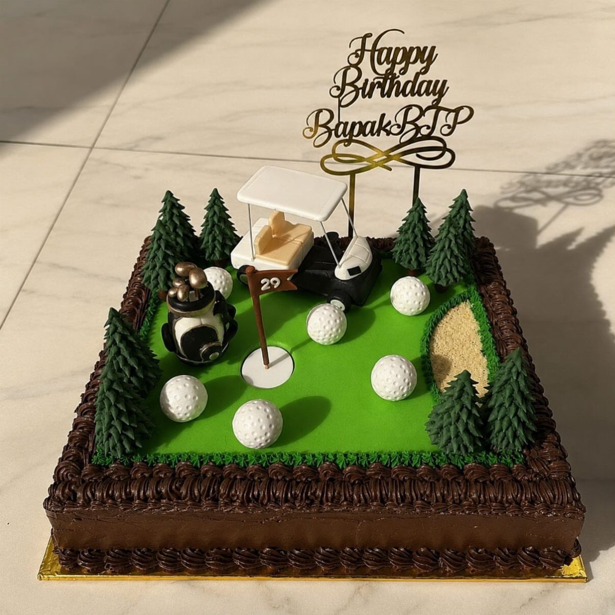 Golf course themed birthday cake with a golf cart, balls, and gold topper.