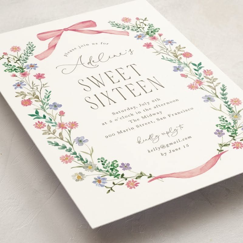 Sweet sixteen invitation card with floral wreath, pink bow, and RSVP contact details.