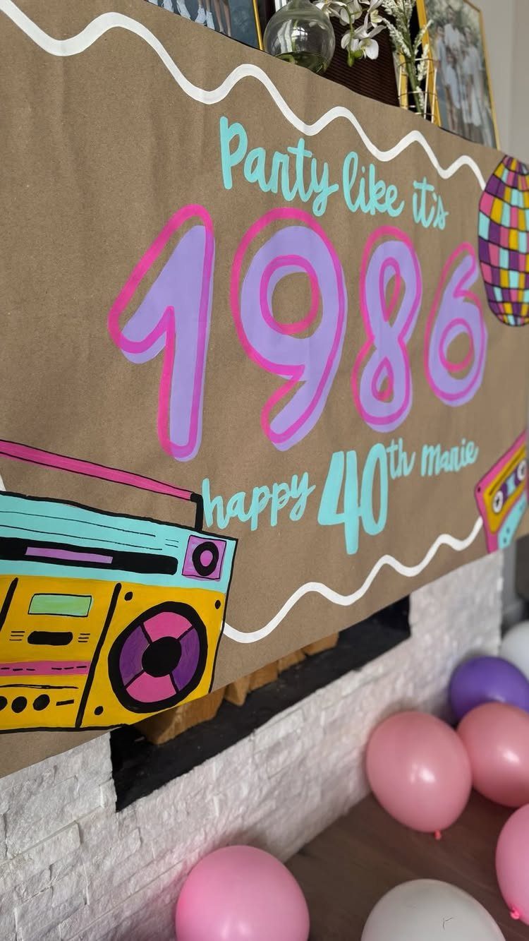 Brown paper birthday banner for a 40th birthday with 1986 theme and balloons.