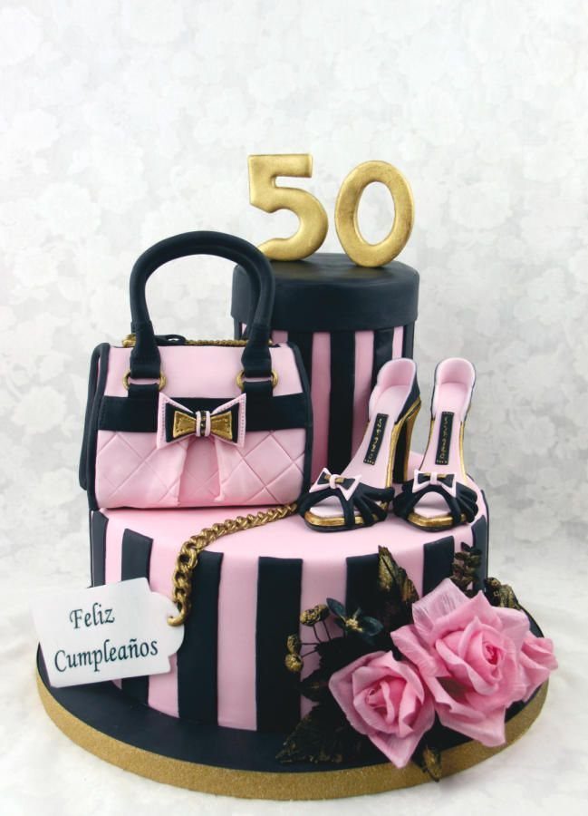 Tiered birthday cake with pink and black stripes, fondant handbag, high heels, and roses.