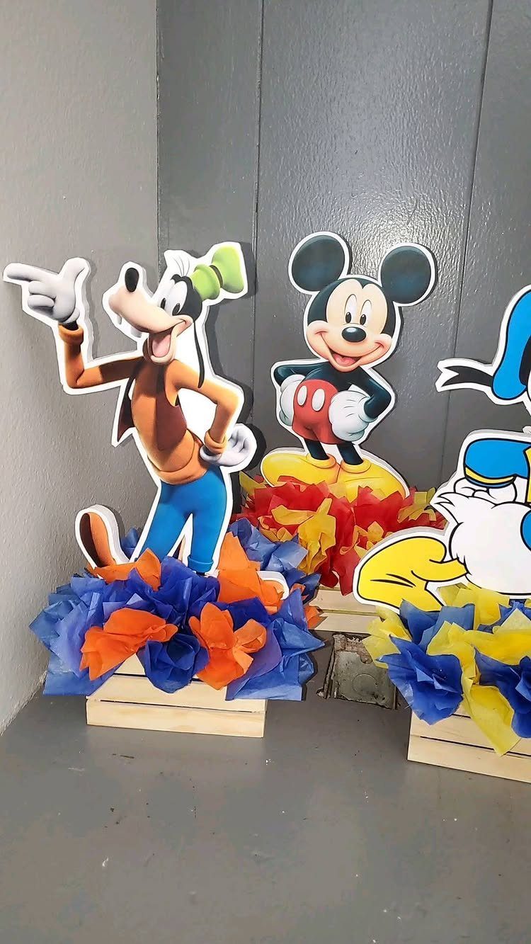Mickey Mouse, Goofy, and Donald Duck cutouts in colorful tissue paper crates.