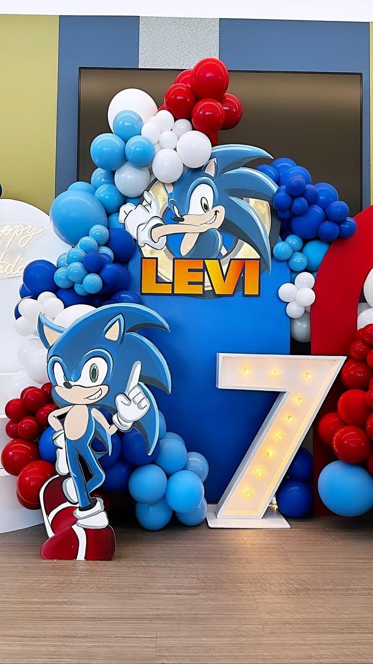 Sonic the Hedgehog foam board cutouts with balloons and a large light-up number 7