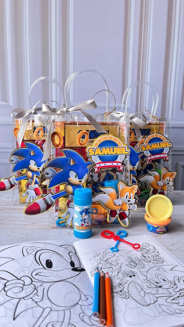 Sonic the Hedgehog party favor bags with coloring books, pencils, and character cutouts.