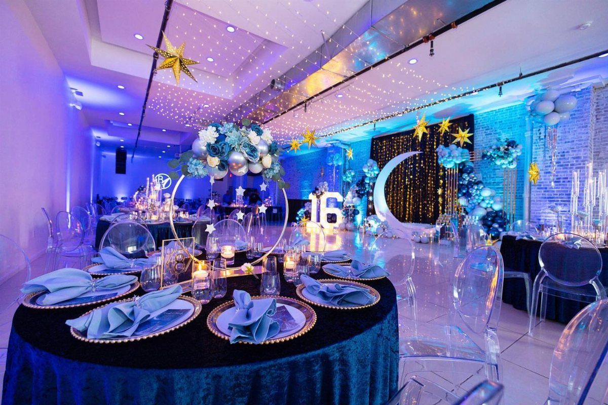 Blue and purple party room with gold stars, crescent moon, and glowing 16 sign.