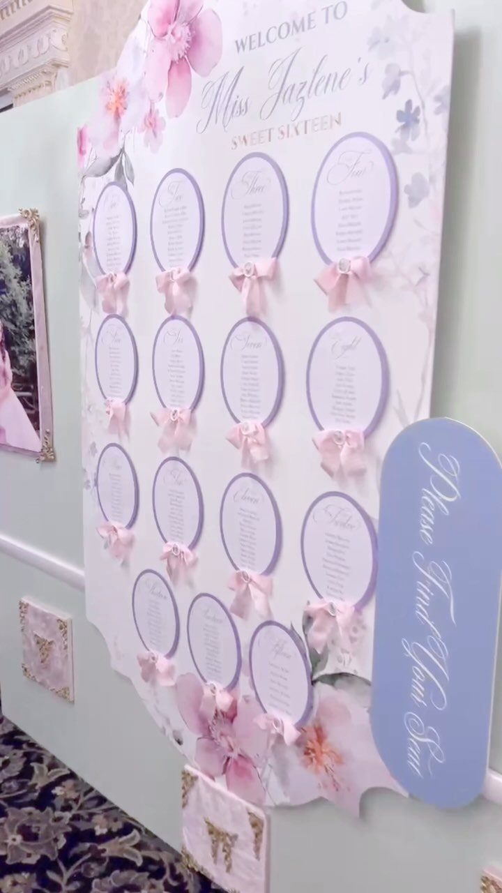 Pink and purple sweet sixteen seating chart board with floral accents and bows.